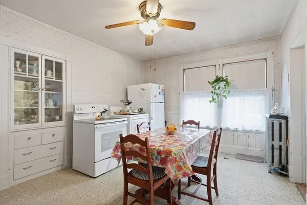 a dining room with furniture and window