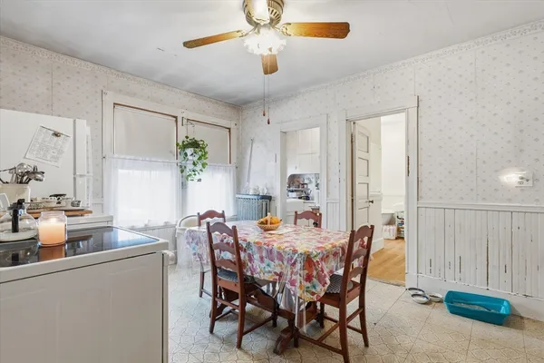 a dining room with furniture and window