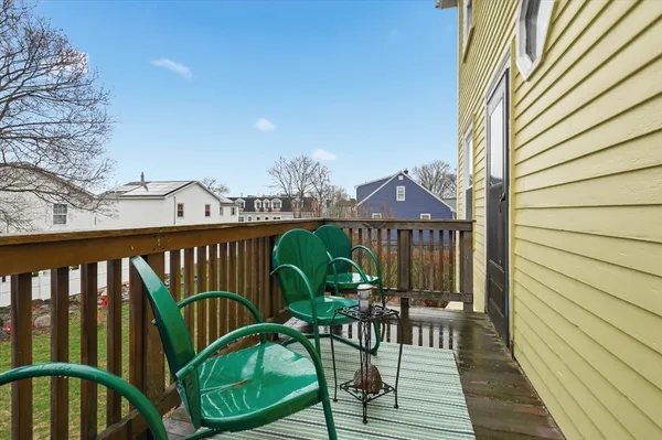 a view of a balcony with chairs