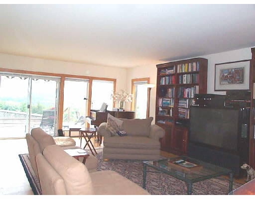 457 Montague Road Sunderland, MA 01375 - Photo 3 of 6 a living room with furniture and a floor to ceiling window