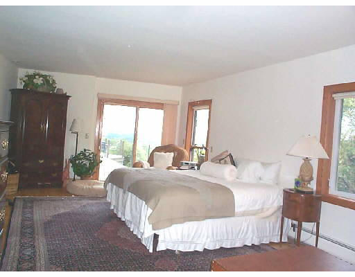 457 Montague Road Sunderland, MA 01375 - Photo 4 of 6 a bed sitting in a bedroom next to a window