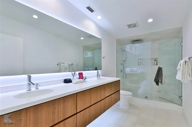 a bedroom with a large bed and a large window