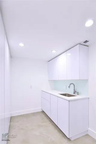 a view of swimming pool with an outdoor seating