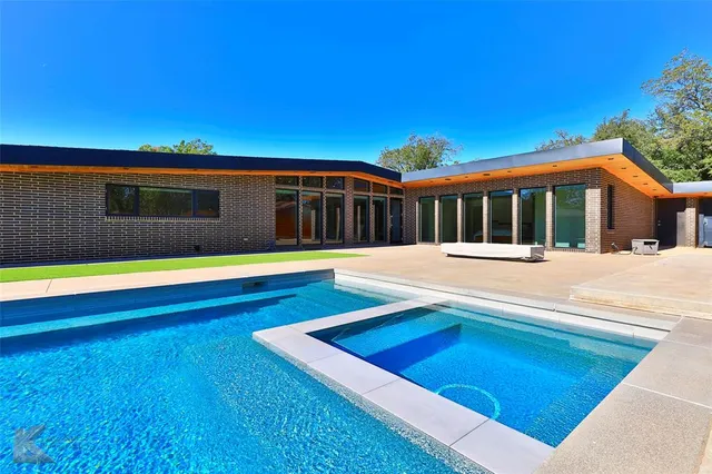 swimming pool view with a outdoor space