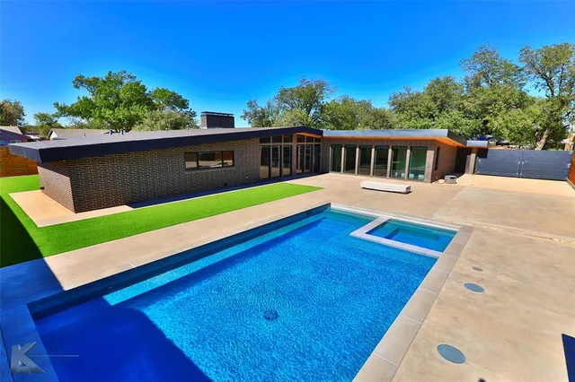a view of a patio with a table and chairs