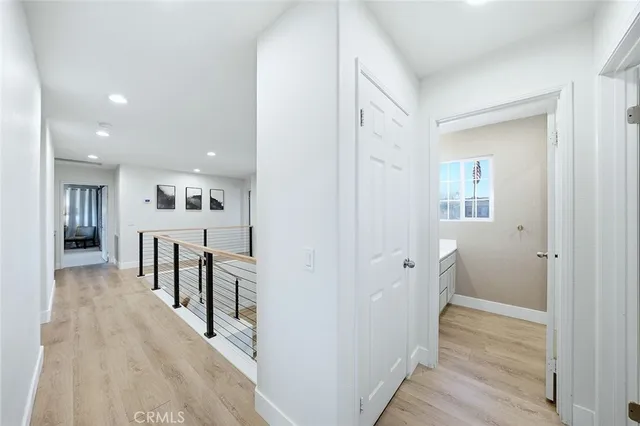 a spacious bedroom with a bed and a window