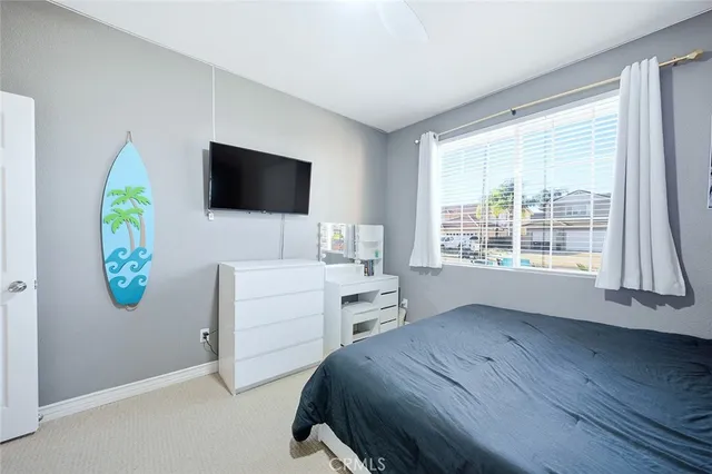 a bathroom with a toilet sink vanity and mirror