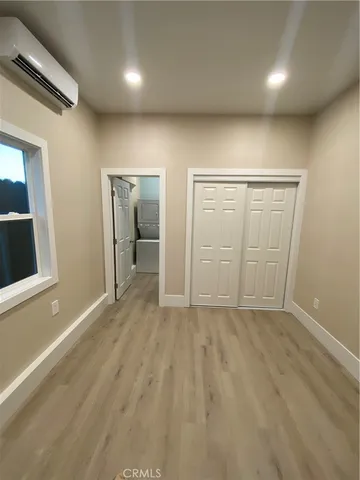 a view of a backyard with table and chairs and couches
