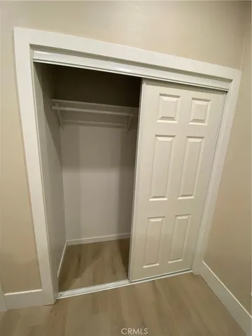 a view of outdoor sitting area with furniture and wooden fence