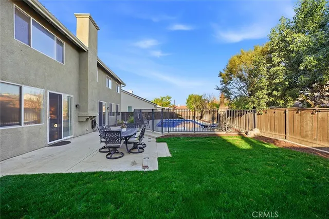 an aerial view of a house with a swimming pool