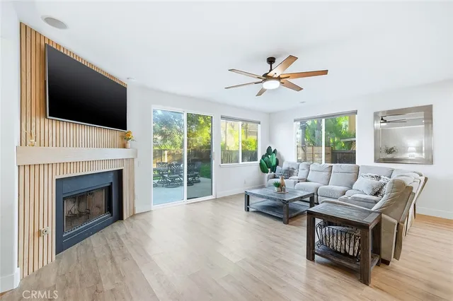 a living room with couches and a flat screen tv