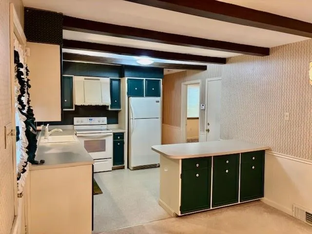 a view of a kitchen with appliances and cabinets