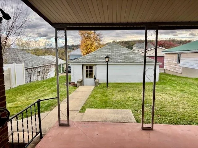 a balcony with view of outdoor space