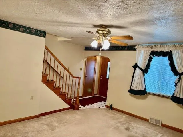 a view of gym equipment with a mirror