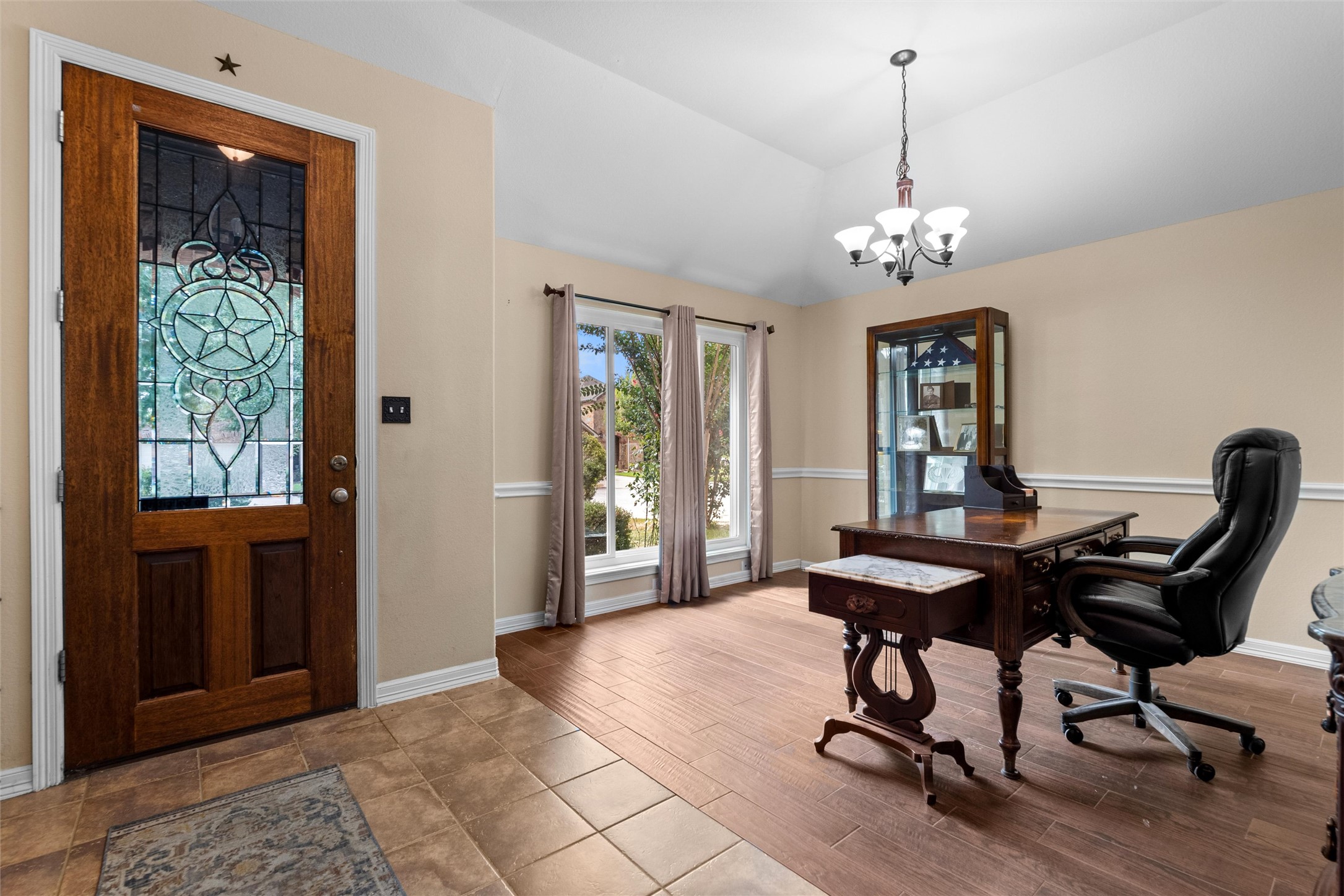 20704 Windmill Ridge Street Pflugerville, TX 78660 - Photo 4 of 34 Enter into this distinguished study, graced by a decorative stained-glass front door and gleaming wood flooring.