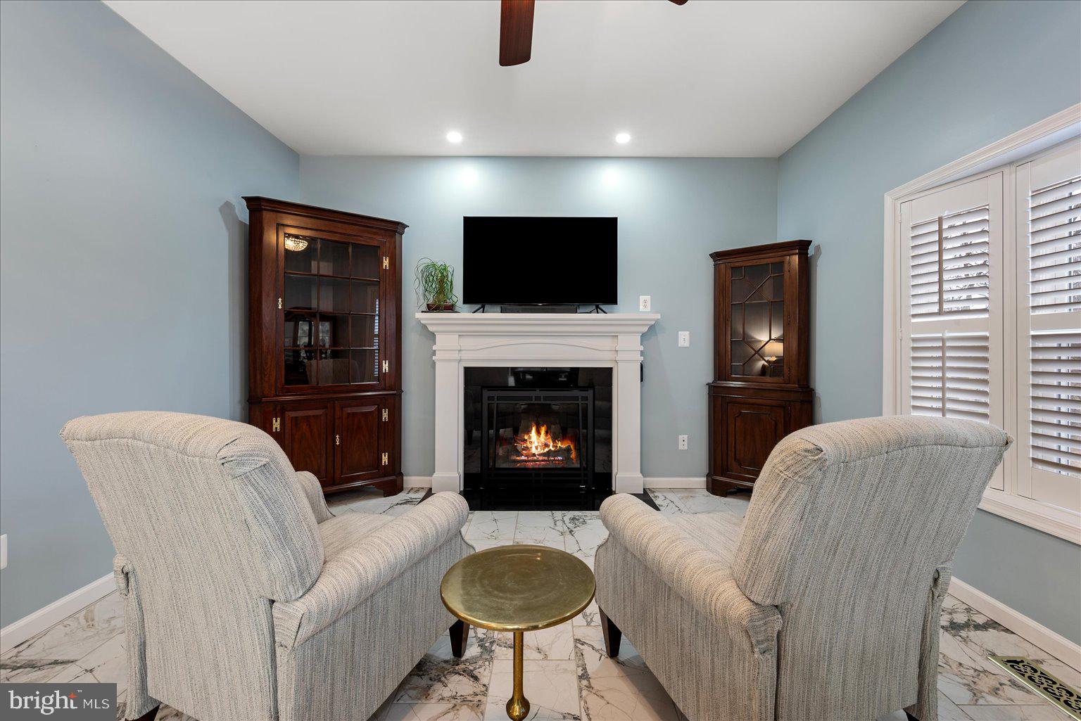 978 Old Charles Town Road Berryville, VA 22611 - Photo 4 of 31 a living room with furniture a flat screen tv and a fireplace