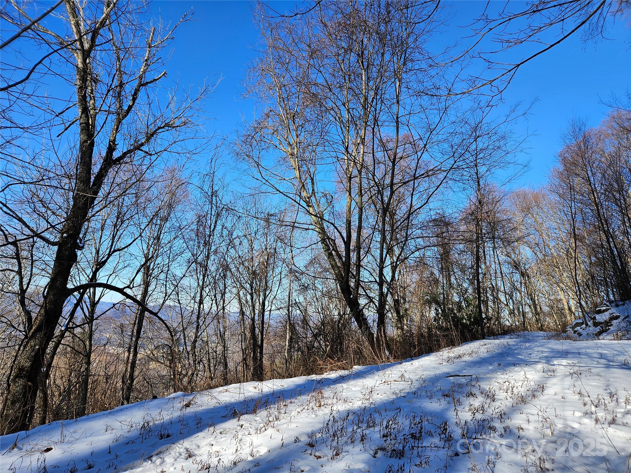 a view of a backyard of snow