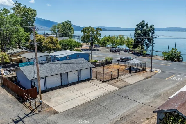 a view of a patio with couches and a fire pit