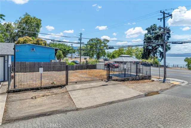 a view of a street with a car park in front of it