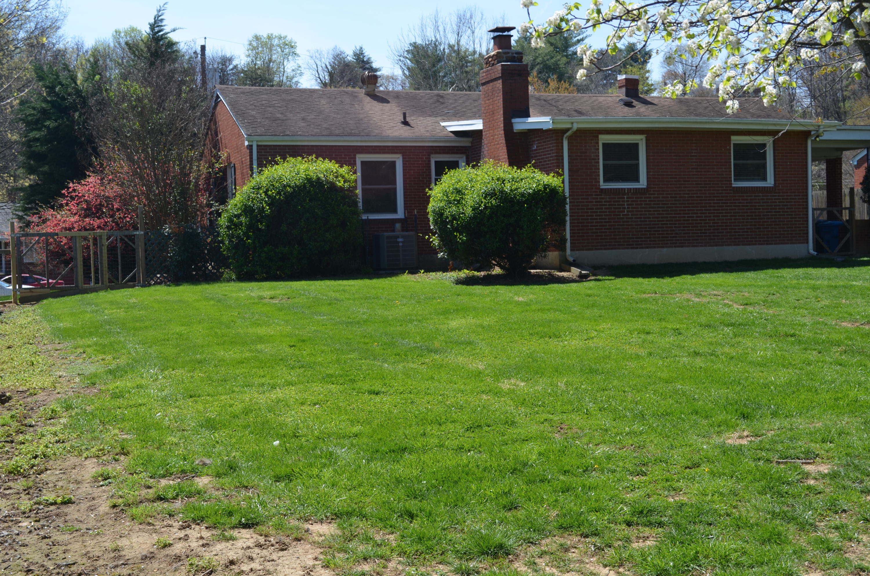 1927 Laura Road Northwest Roanoke, VA 24017 - Photo 16 of 19 a front view of house with yard and trees in the background