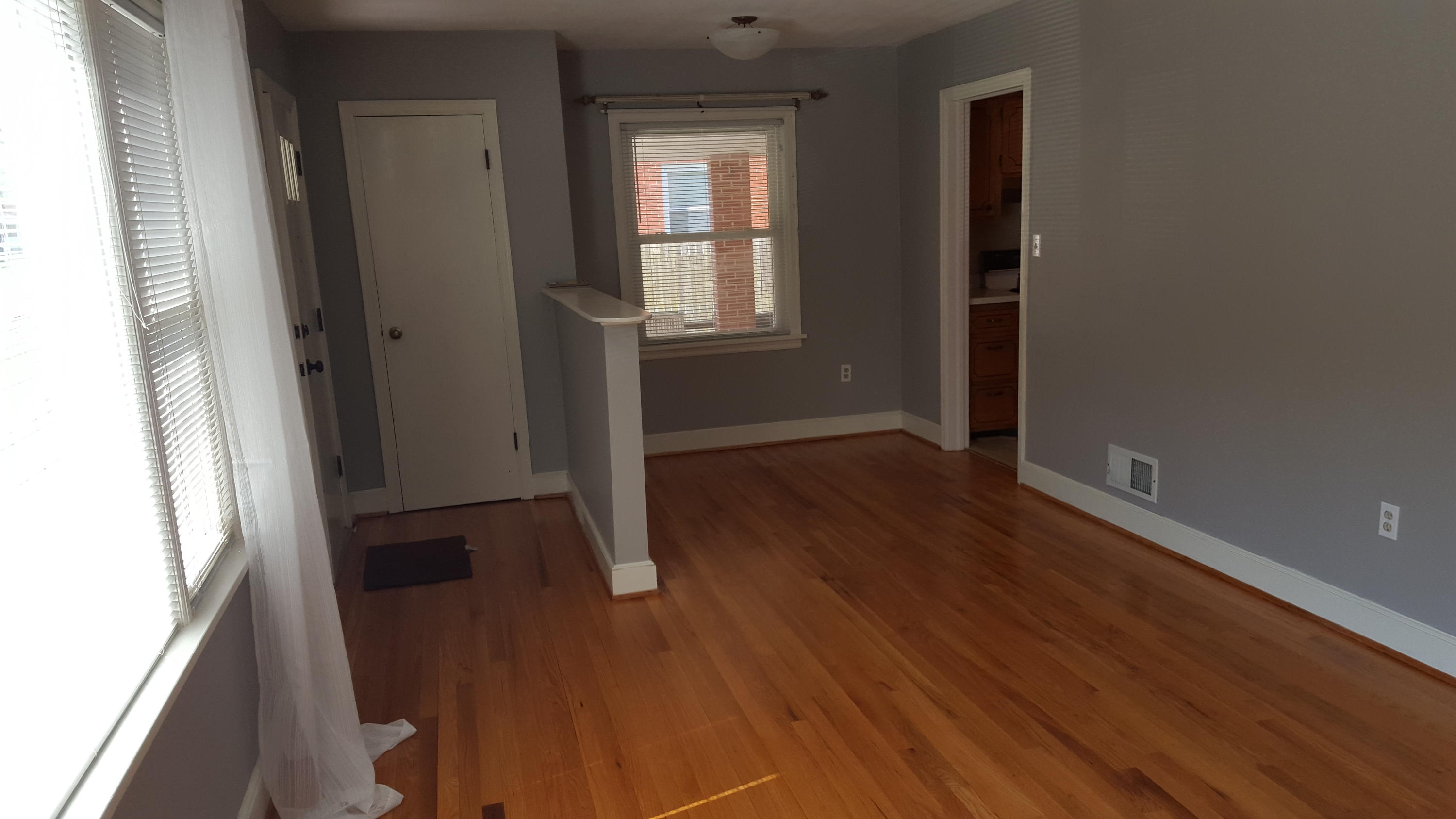 1927 Laura Road Northwest Roanoke, VA 24017 - Photo 4 of 19 an empty room with wooden floor and windows