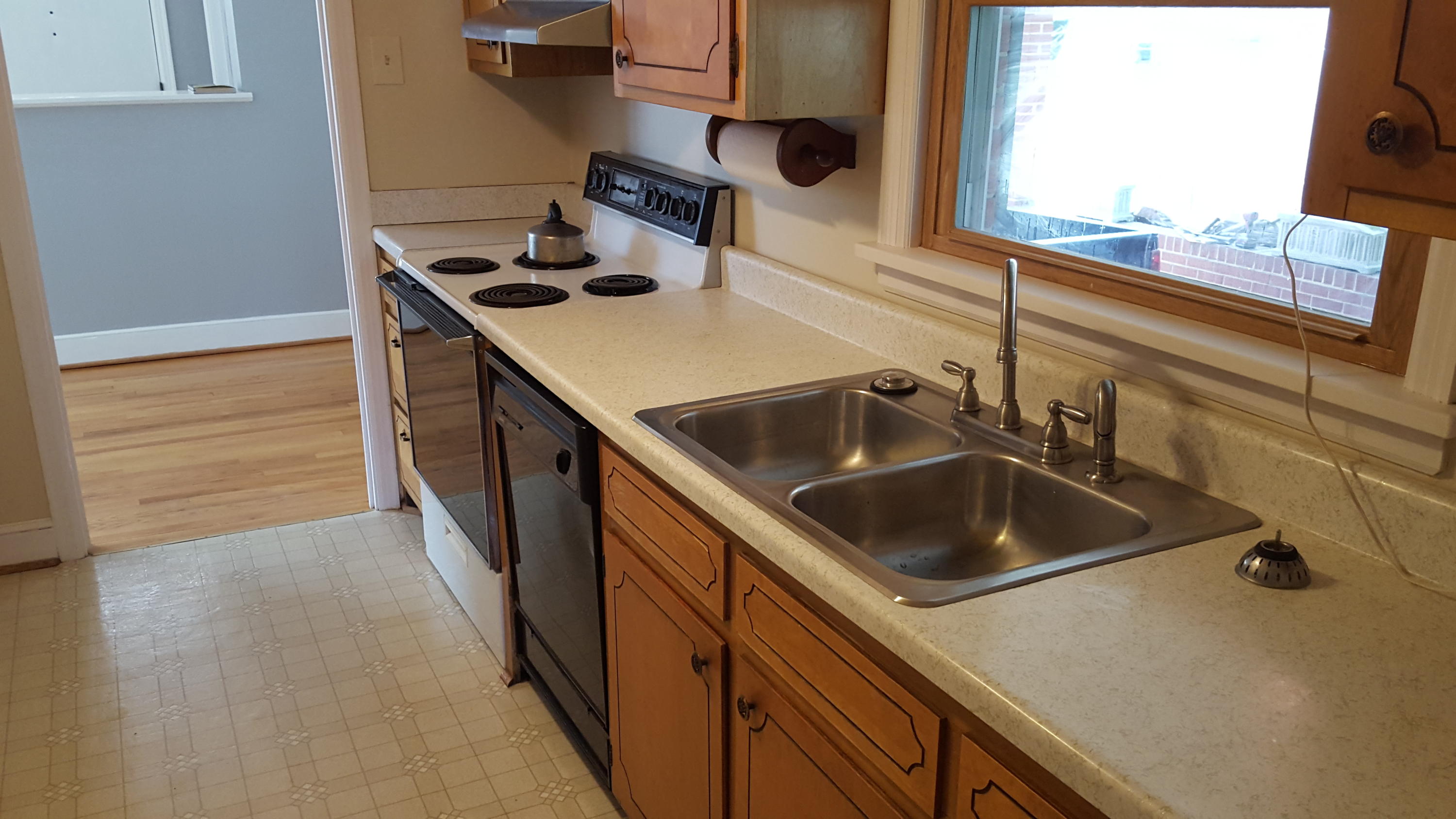 1927 Laura Road Northwest Roanoke, VA 24017 - Photo 6 of 19 a kitchen with a sink and a stove