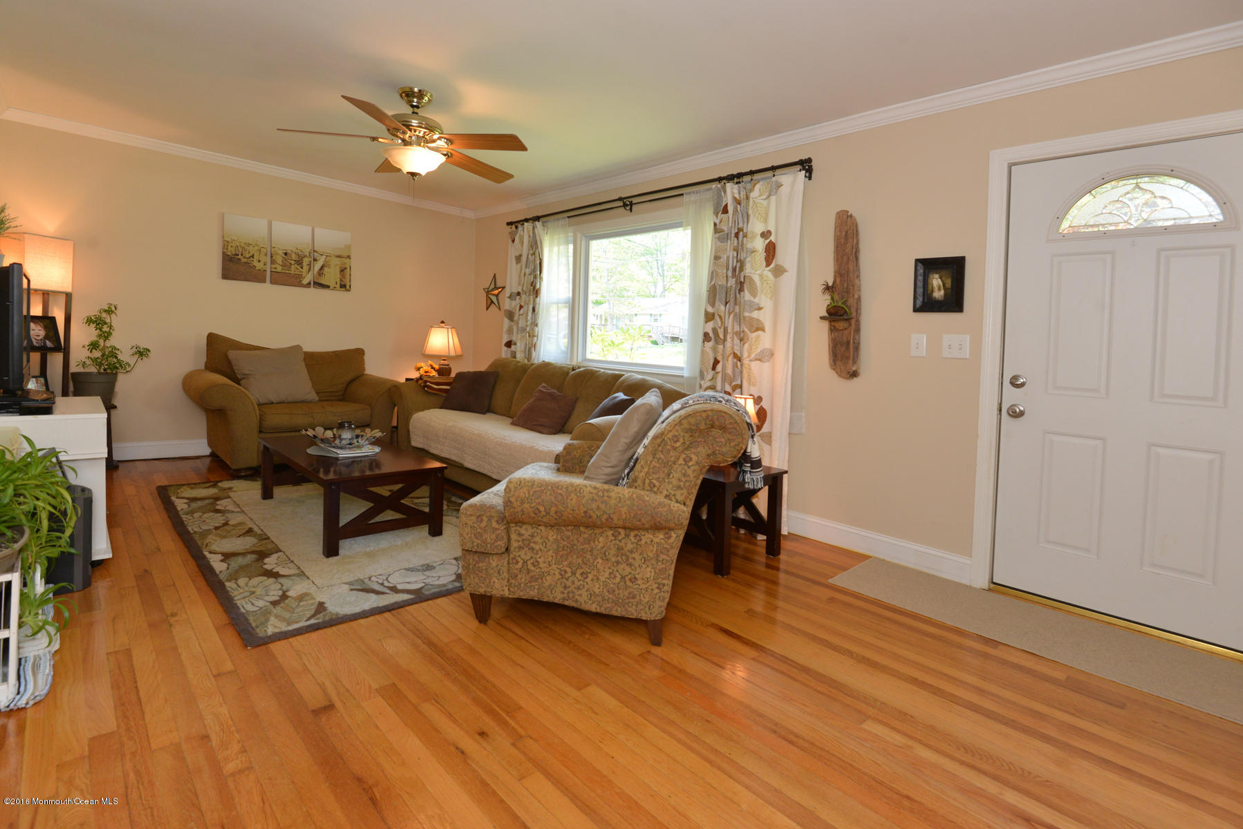 512 Lakewood Road Neptune Township, NJ 07753 - Photo 11 of 28 a living room with furniture and a wooden floor