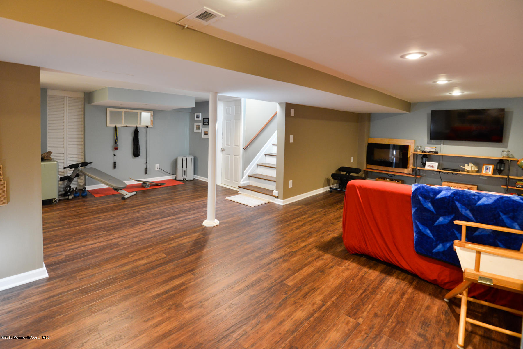 512 Lakewood Road Neptune Township, NJ 07753 - Photo 17 of 28 a living room with furniture and a flat screen tv