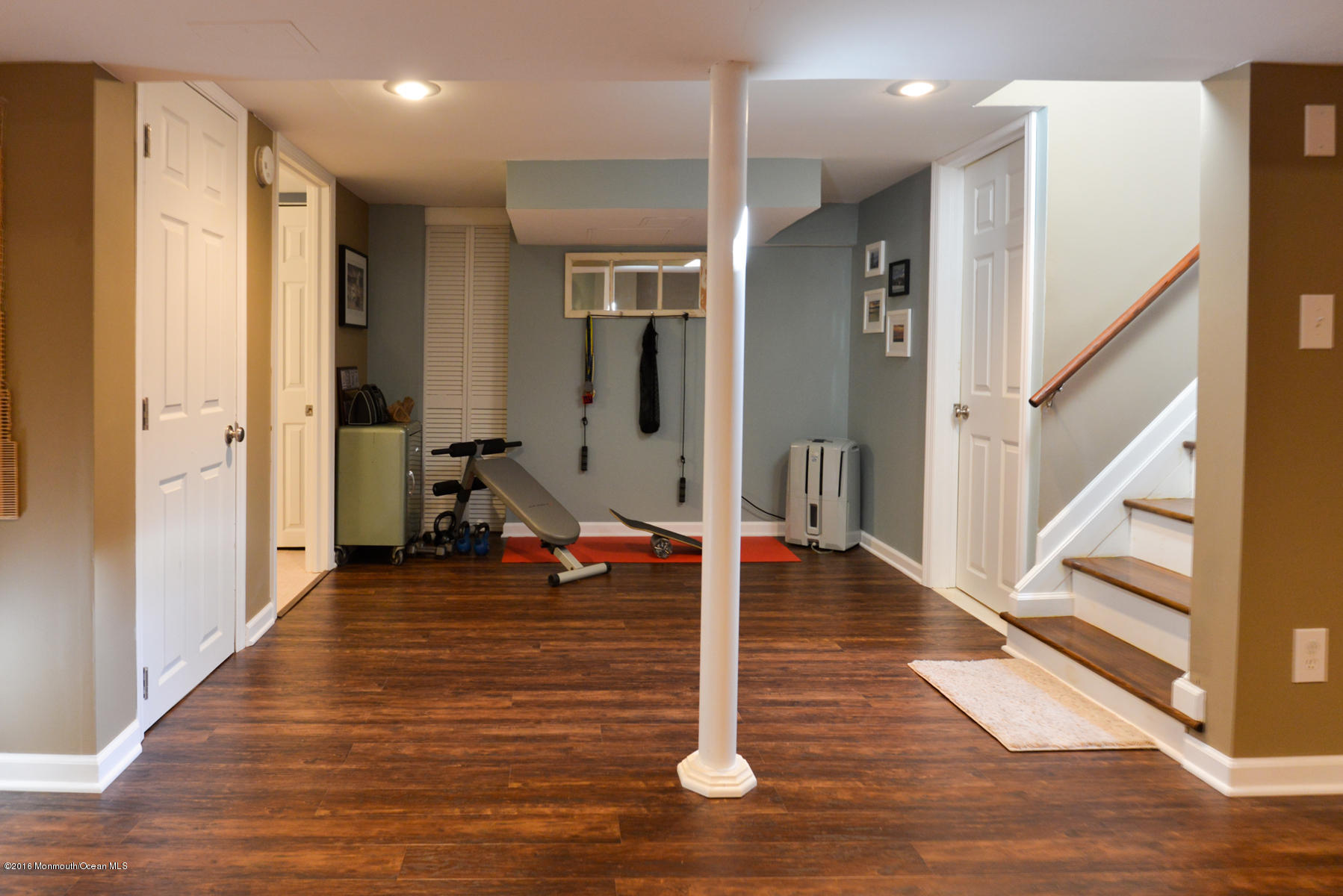 512 Lakewood Road Neptune Township, NJ 07753 - Photo 18 of 28 a view of a room with wooden floor and stairs