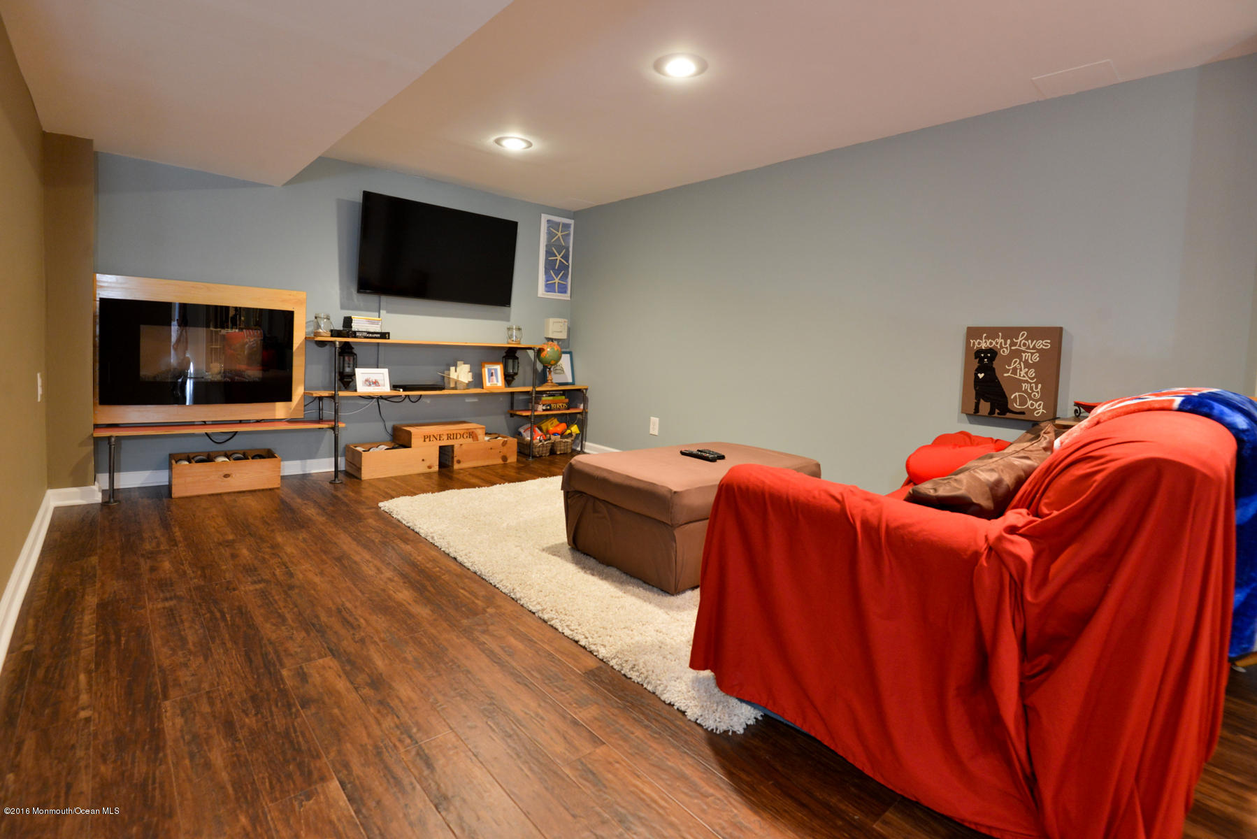 512 Lakewood Road Neptune Township, NJ 07753 - Photo 19 of 28 a living room with furniture and a flat screen tv