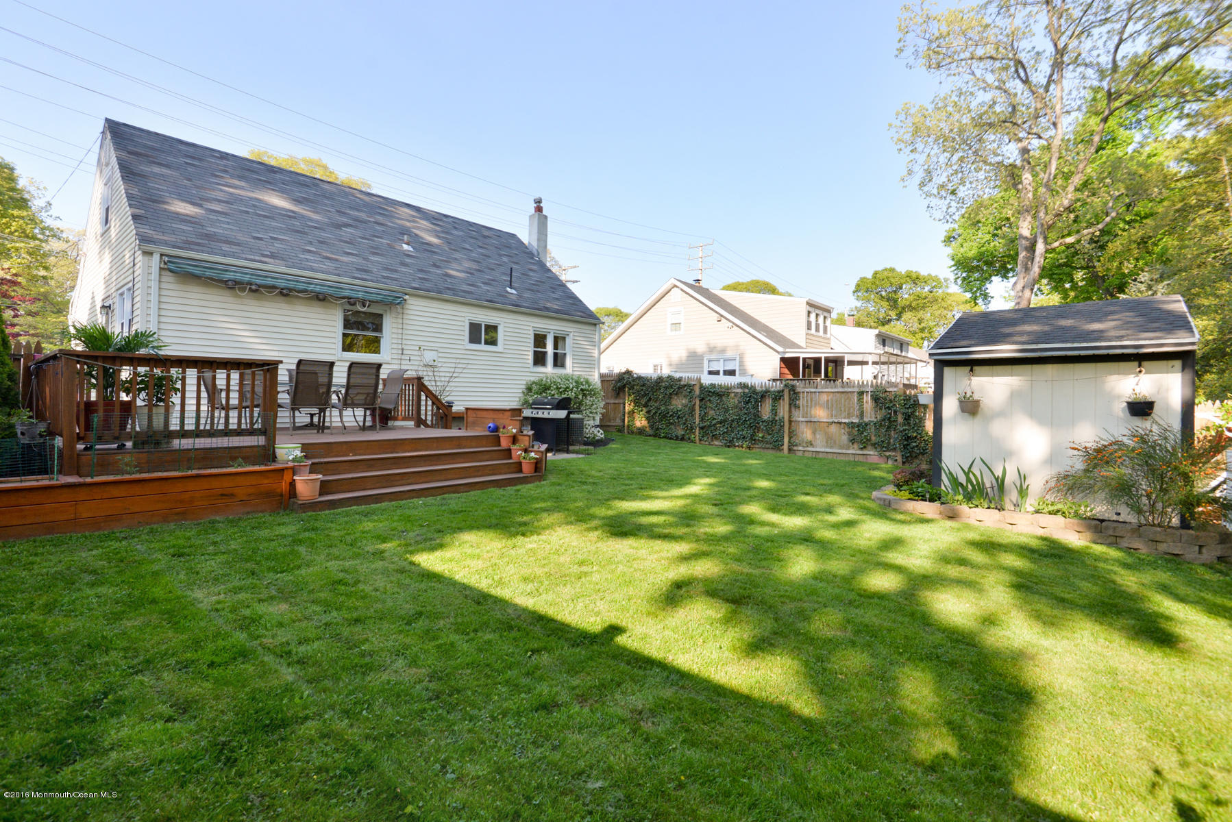 512 Lakewood Road Neptune Township, NJ 07753 - Photo 24 of 28 a front view of a house with garden