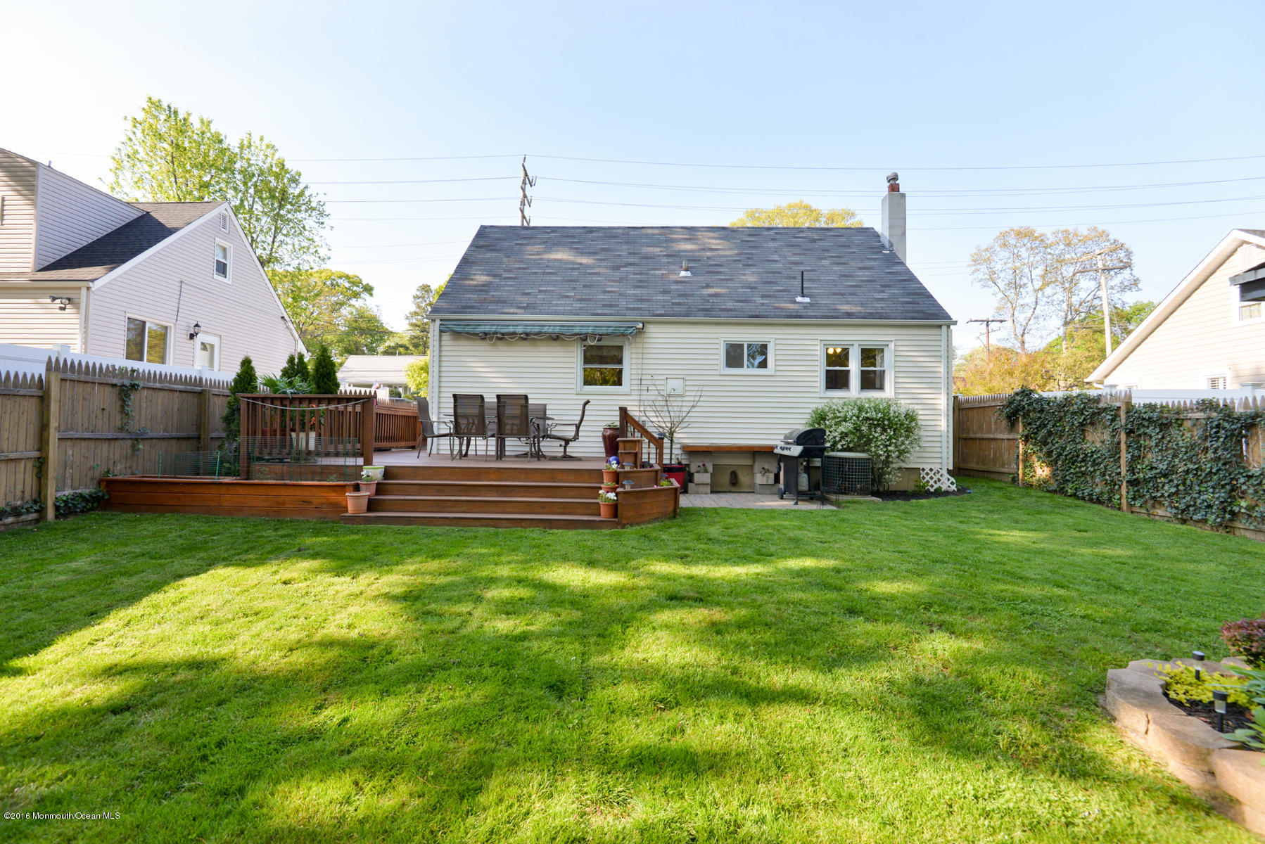 512 Lakewood Road Neptune Township, NJ 07753 - Photo 25 of 28 a view of a house with a backyard