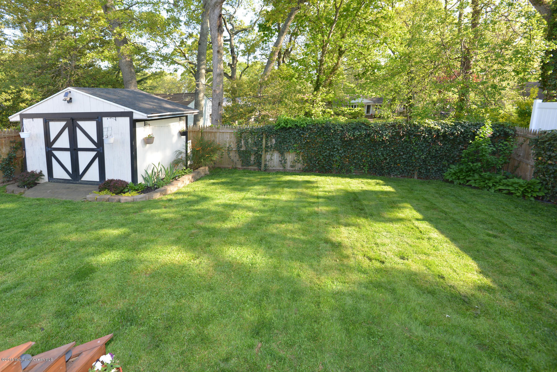 512 Lakewood Road Neptune Township, NJ 07753 - Photo 28 of 28 a backyard of a house with lots of green space