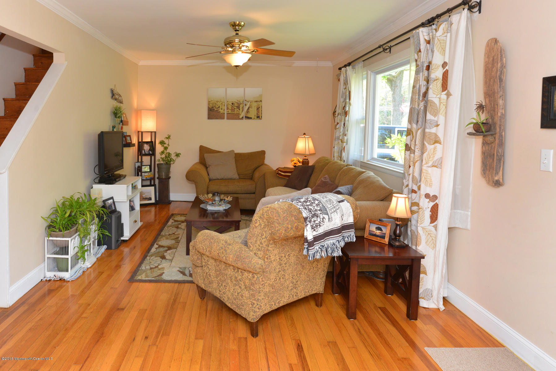 512 Lakewood Road Neptune Township, NJ 07753 - Photo 9 of 28 a living room with furniture fireplace and a table
