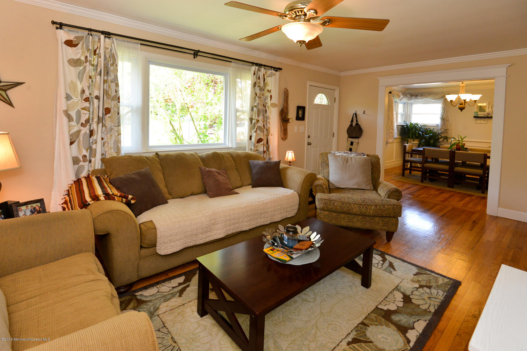 512 Lakewood Road Neptune Township, NJ 07753 - Photo 10 of 28 a living room with furniture and a large window
