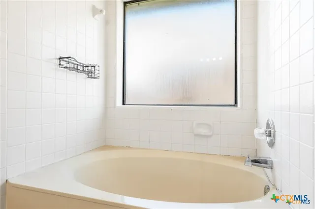 a bathroom with a bathtub