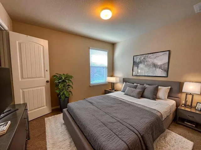 an empty room with windows and entrance