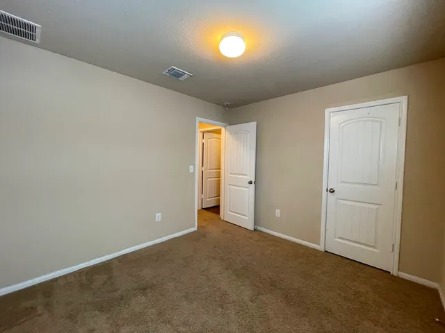 an empty room with a empty space and windows