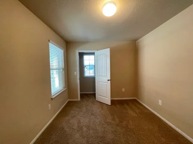 a bathroom with a toilet sink and a shower