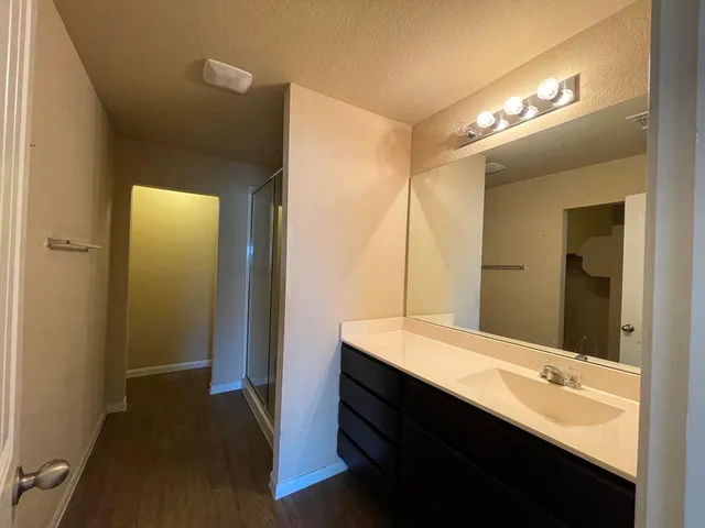 a view of a door and a wooden floor