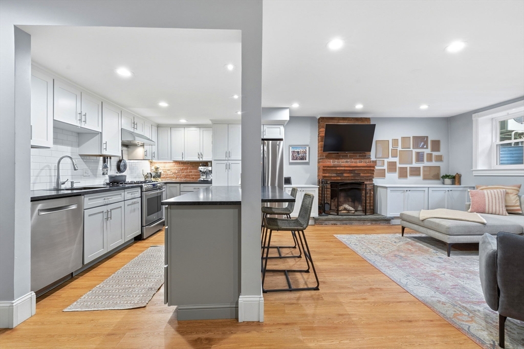 35 High Street, Unit 1 Boston, MA 02129 - Photo 17 of 33 a kitchen with stainless steel appliances granite countertop a refrigerator stove microwave and sink