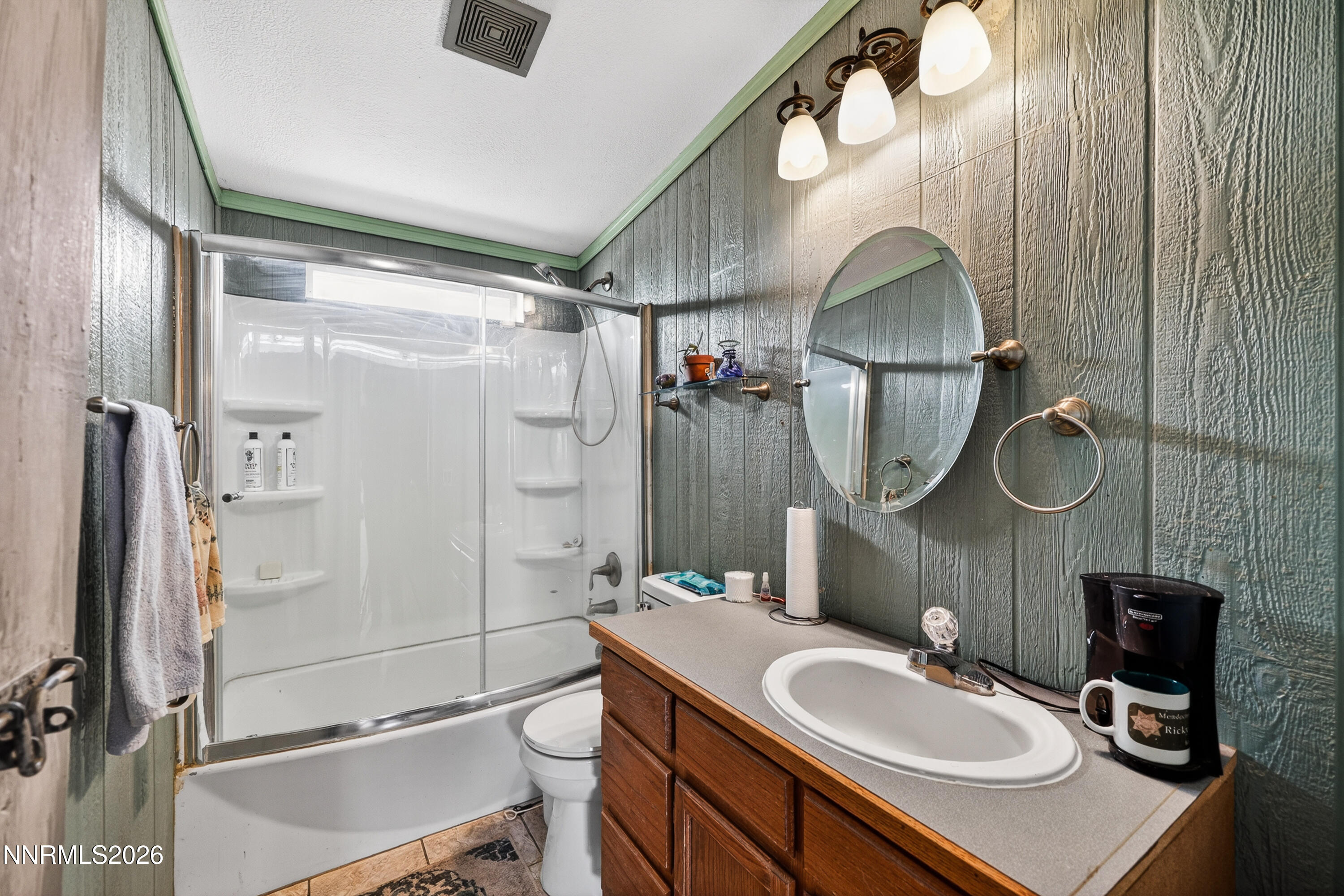 6877 Victor Drive Fallon, NV 89406 - Photo 16 of 50 a bathroom with a sink toilet a mirror and shower