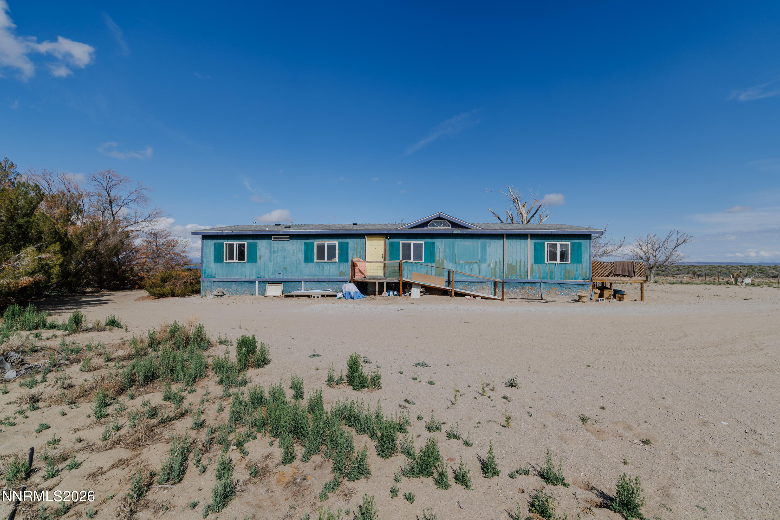 6877 Victor Drive Fallon, NV 89406 - Photo 3 of 50 a view of house with outdoor space and garden