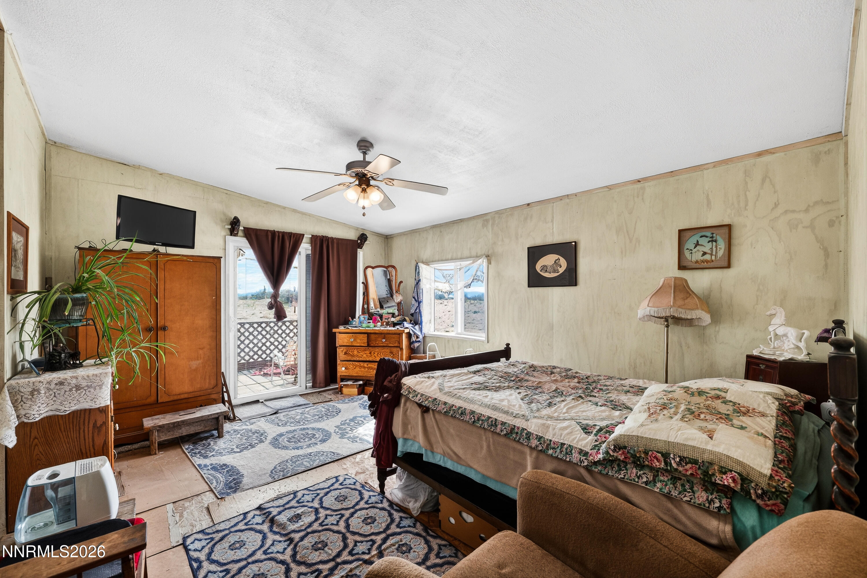 6877 Victor Drive Fallon, NV 89406 - Photo 7 of 50 a bedroom with a bed a couch and dresser