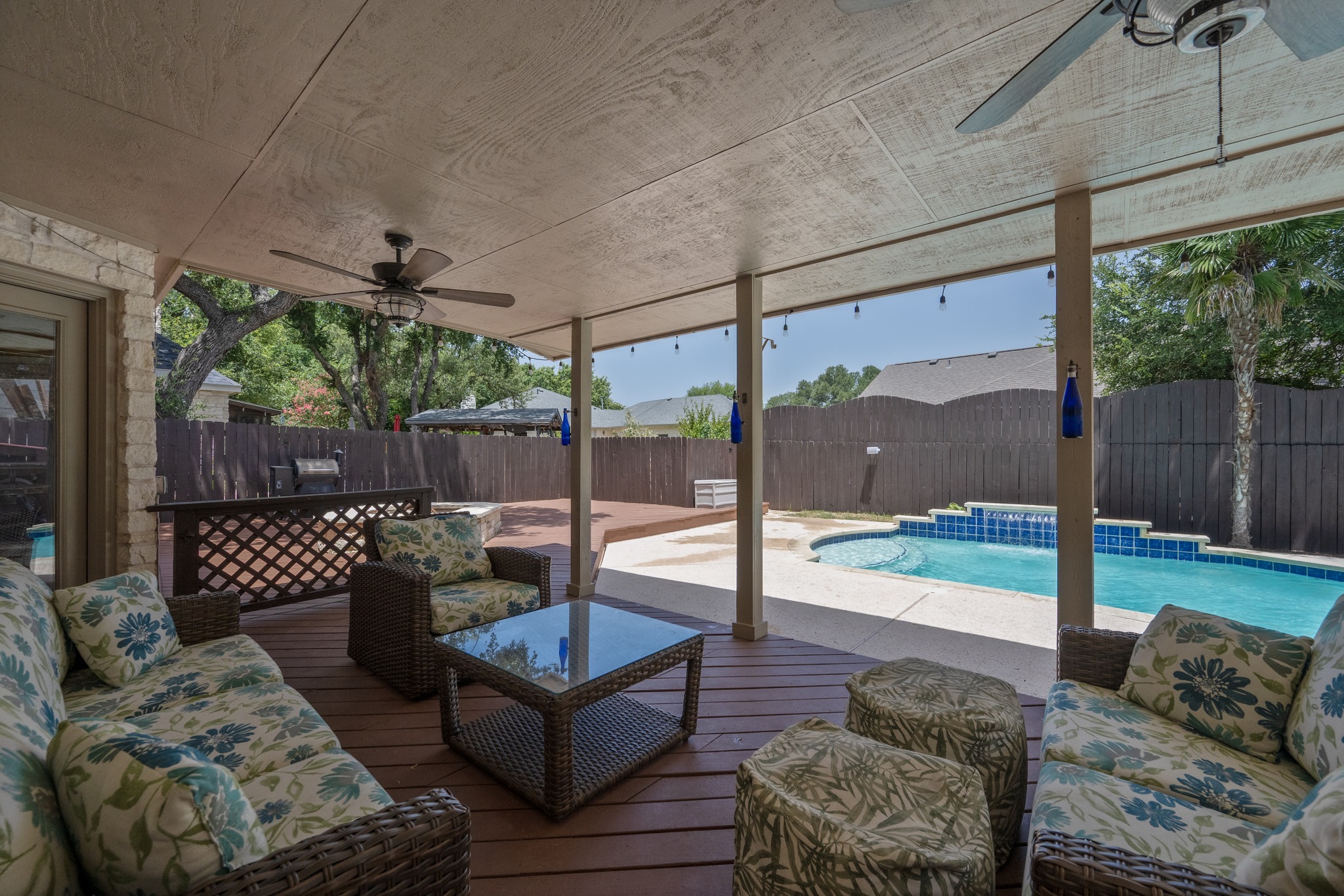 108 Thornwood Road Georgetown, TX 78628 - Photo 38 of 40 An inviting covered patio offers ample space for outdoor relaxation and entertainment beside a sparkling pool.