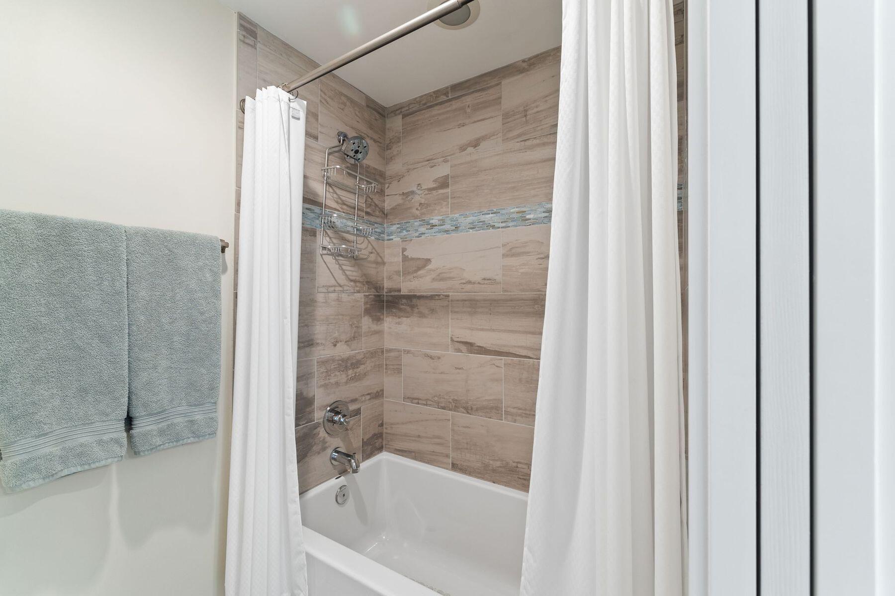 386 Redbud Lane Inlet Beach, FL 32461 - Photo 41 of 54 a bathroom with a bathtub and a shower