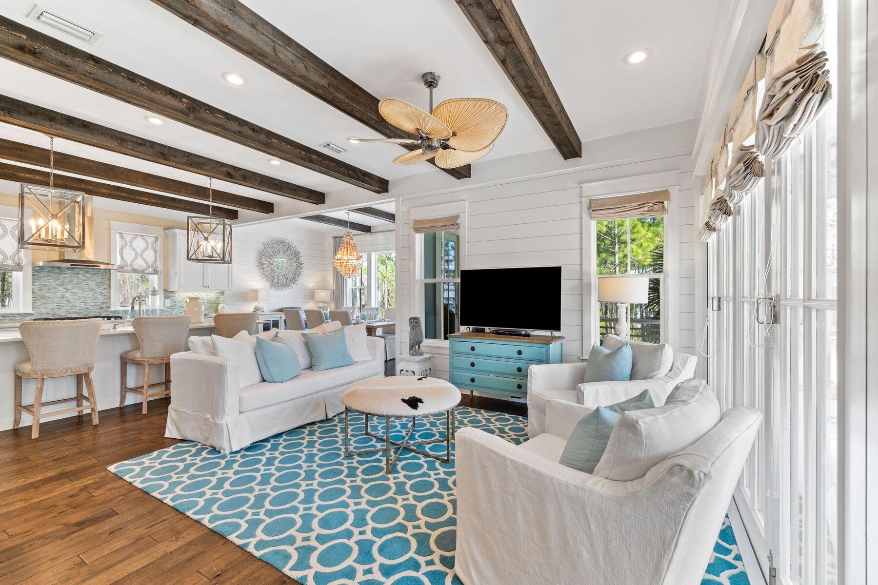 386 Redbud Lane Inlet Beach, FL 32461 - Photo 7 of 54 a living room with furniture and a flat screen tv