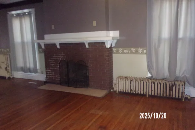 an empty room with wooden floor