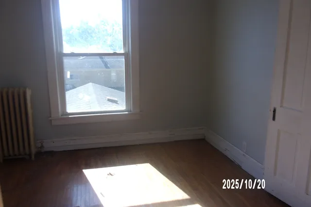 a view of an empty room and window