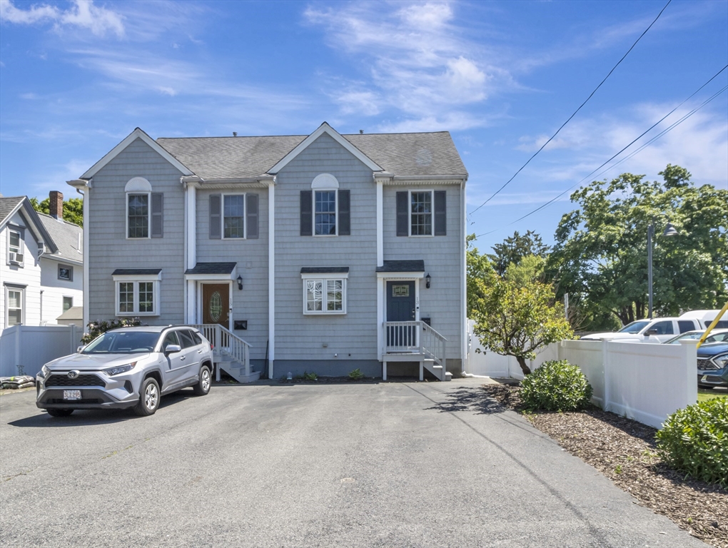 13 Shawmut Avenue, Unit 13 Mansfield, MA 02048 - Photo 1 of 34 a view of multiple houses with a yard